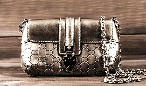 Ladies handbag with a chain of genuine leather