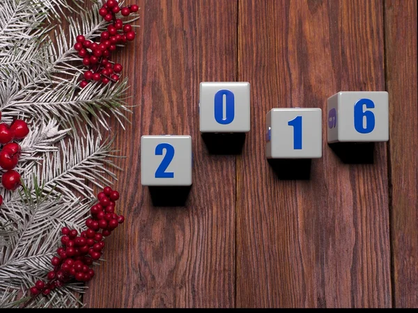 Happy New Year card with  snow on wooden background