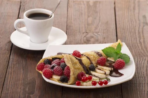Crepe with Strawberry, Raspberry, Blueberry and Chocolate topping. Pancake