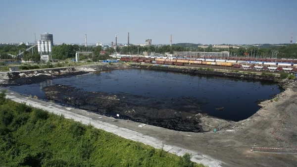 OSTRAVA, CZECH REPUBLIC, AUGUST 3, 2015: The former dump toxic waste in Ostrava, oil lagoon, Ostramo, Moravia-Silesia Region, Europe, EU