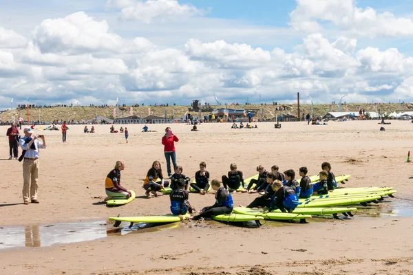 Kids surf lessons on Scheveningen beach, The Hague, Netherlands