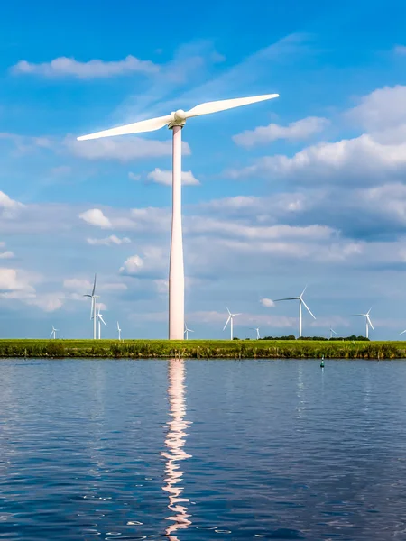 Waterfront wind turbine in polder, Holland