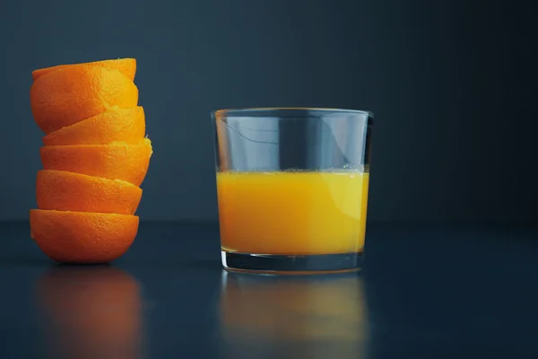 Citrus peels and juice glass isolated