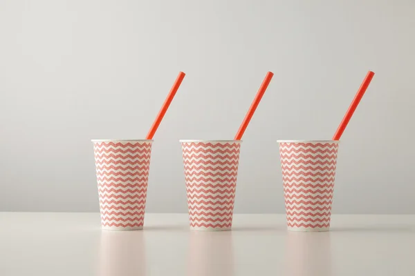 Paper cups decorated with red lines