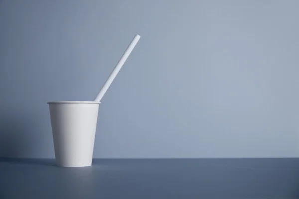 White paper cups isolated on gray