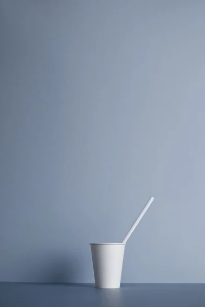 White paper cups isolated on gray