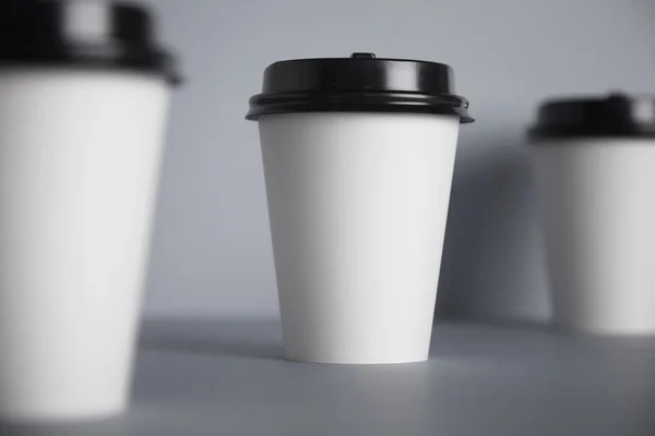 Three take away white paper cups