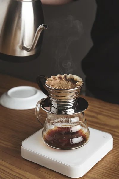 Close up  of preparing filtered coffee in drip machine