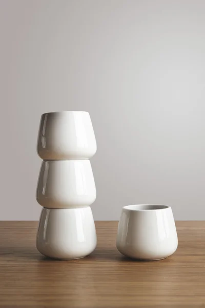 Side view top narrow ceramic coffee cups on table