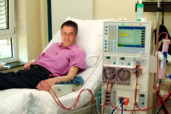 Patient on dialysis machine