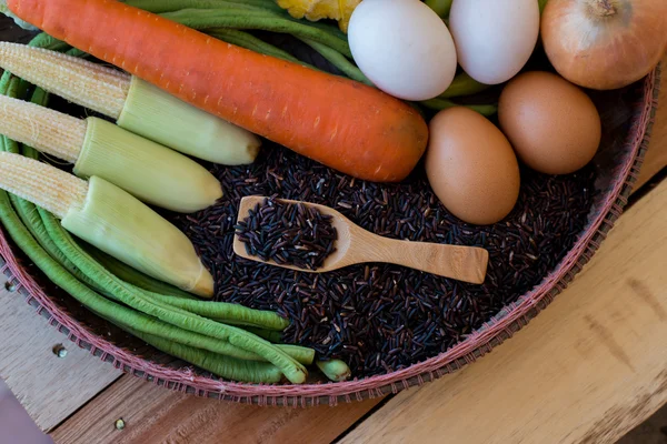 Clean food,vegetables set ,wood dish and wood fork on wooden table