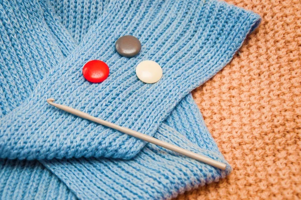 Knitting needle on the crochet fabric