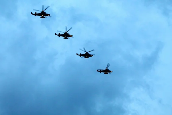 Group of helicopters in sky