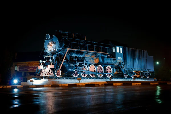 Old steam train at night