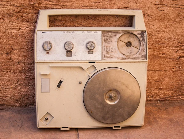 Antique radio on vintage stone grunge background, retro old phot