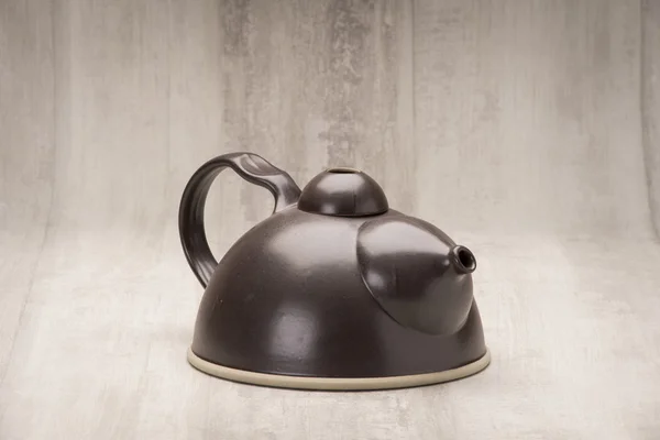 A Black Teapot or Kettle Facing Front