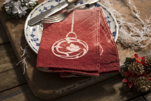 Pair of Red Folded Napkins on Plate with Christmas Decor