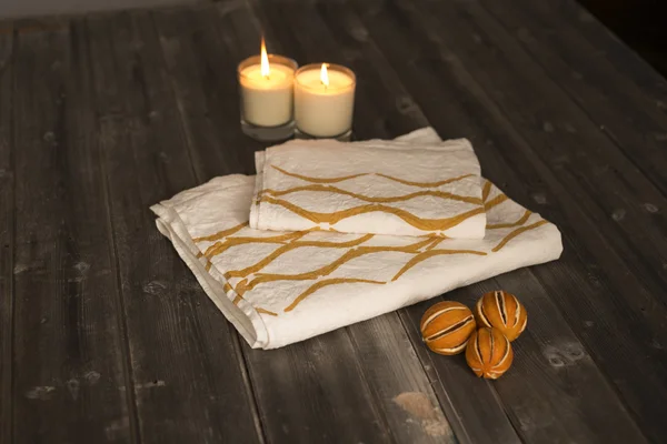 Folded Towel and Napkin with Orange Concave Line Design