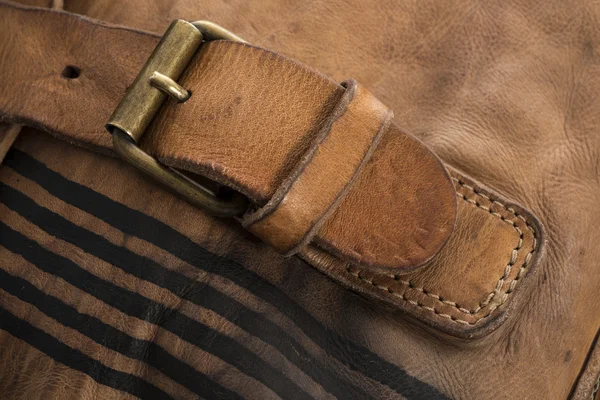 Close Up of Leather Strap Fastened to a Metal Buckle
