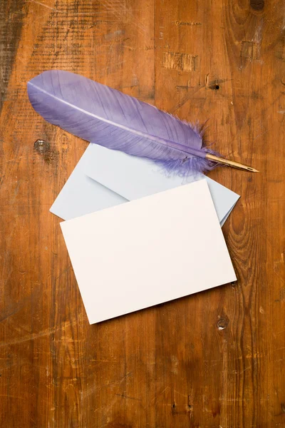 Blank Greeting or Invitation Card and Purple Feather