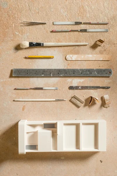 Arts and Crafts Tools and a Plaster Building Scale Model
