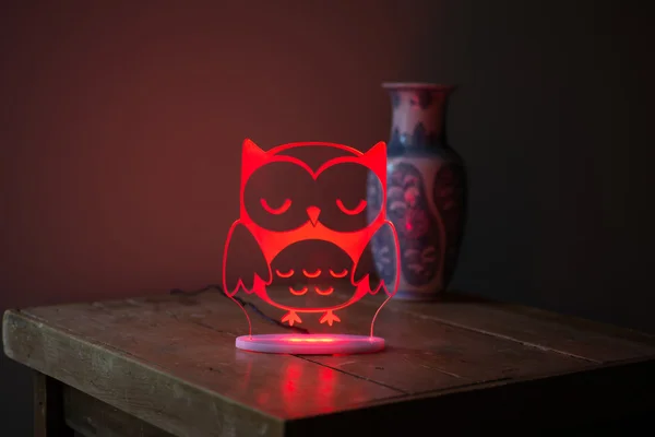 Red Illuminated Crystal Desk Lamp with Owl Imprint On Sidetable