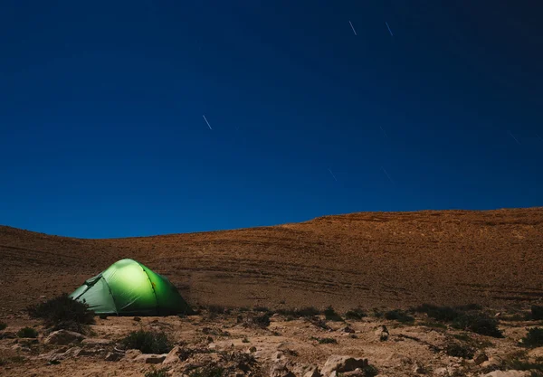 Illuminated tent at night. Camping at night