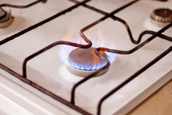 Burning gas on kitchen gas stove