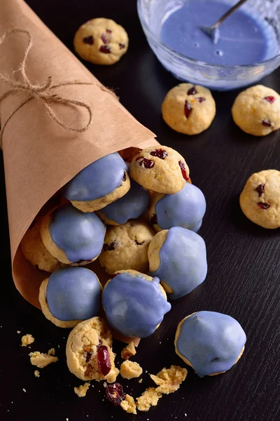 Cottage cheese cookies with cranberries in the blue glaze