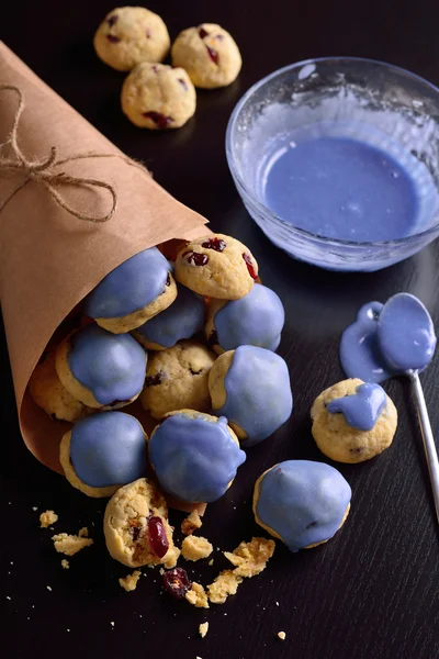 Cottage cheese cookies with cranberries in a blue glaze and in k