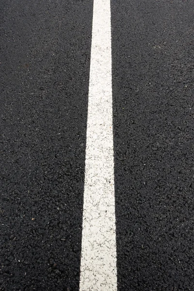 Straight line on asphalt traffic road.