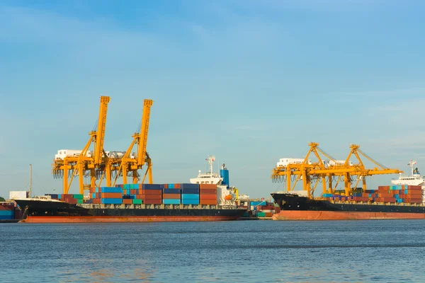 Cargo ship loading containers on schedule.