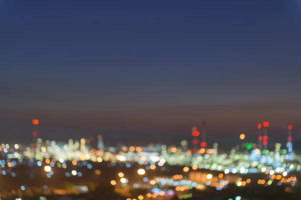 Bokeh of oil refinery plant at twilight, Blur background.