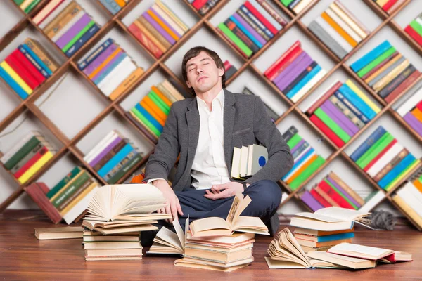 Tired sleeping man in the library