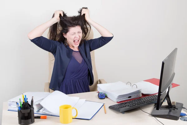 Angry screaming woman in office