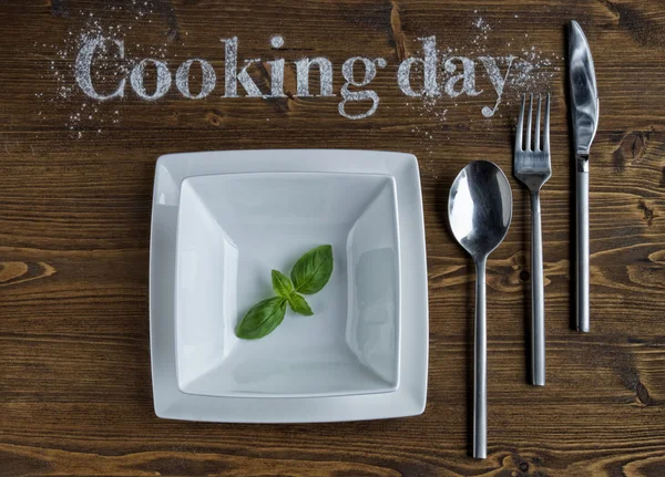 Cooking concept with  tableware on a wooden background. Vegetarian food, health or cooking concept. Cooking day.
