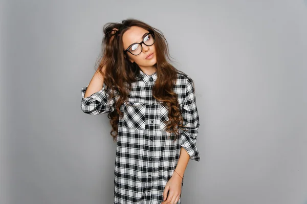 Portrait of cute teen girl wearing stylish shirt isolated on gray background fashion for teenagers