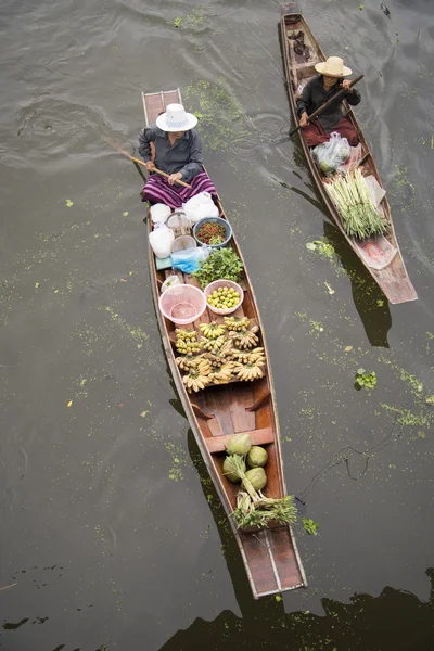 RATCHABURI THAILAND -Oct 3: Wooden boats are loaded with fruits