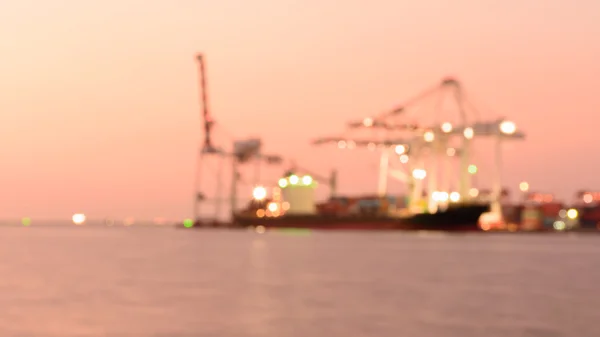 Out of focus  Containers loading by crane in the evening , Trade