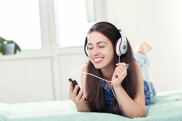 Girl in headphones listening music