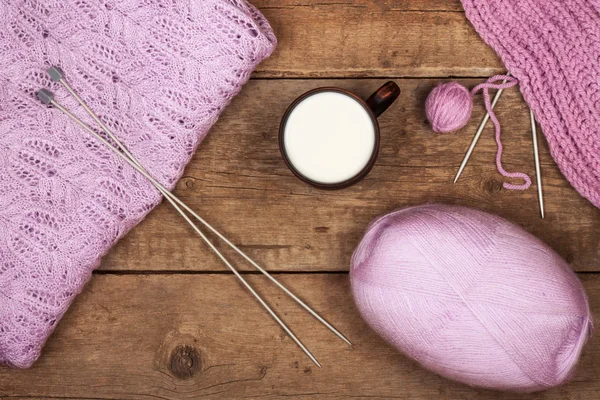 Purple sweater with a cup of warm milk