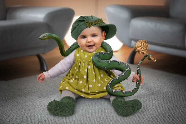 Girl sitting with green rattlesnake