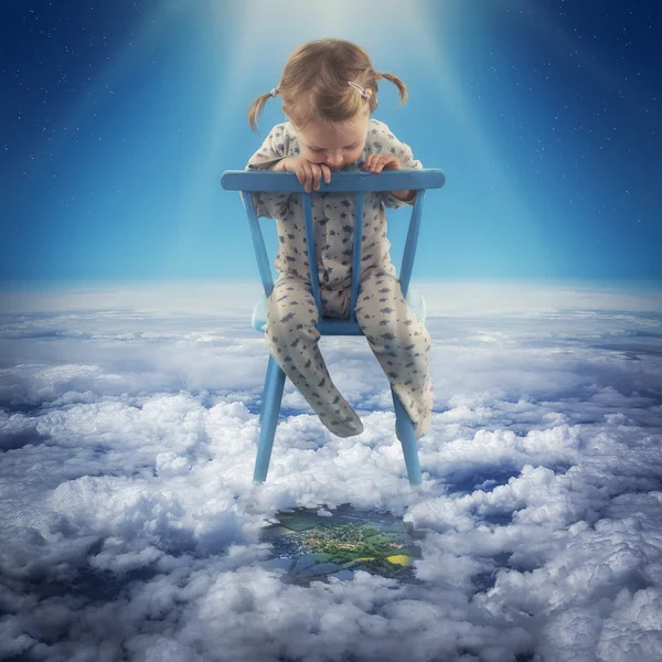 Girl sitting on the chair in the sky