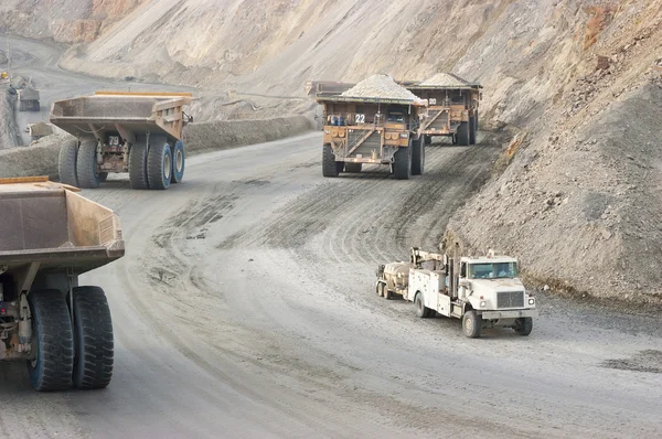 Convoy of large dump truck in copper mine