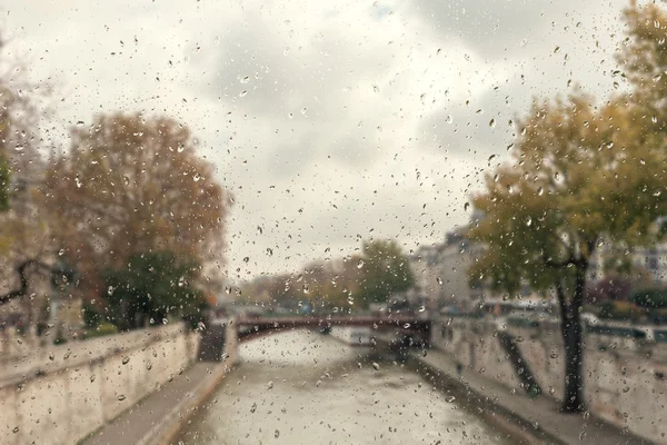 Abstract blurry background with water drops: view through the window Paris France