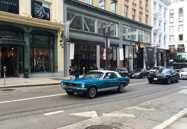 SAN FRANCISCO, USA - June 13, 2015: Man drives the old  Ford Mustang Shelby GT350 in the center of San Francisco.