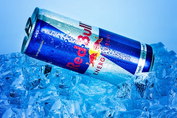 TRIESTE, ITALY-MAY 29, 2016: Aluminium can of Red Bull Energy drink on ice.Isolated on white Background.Red Bull is the most popular energy drink in the world, with 5,226 billion cans sold in 2012.