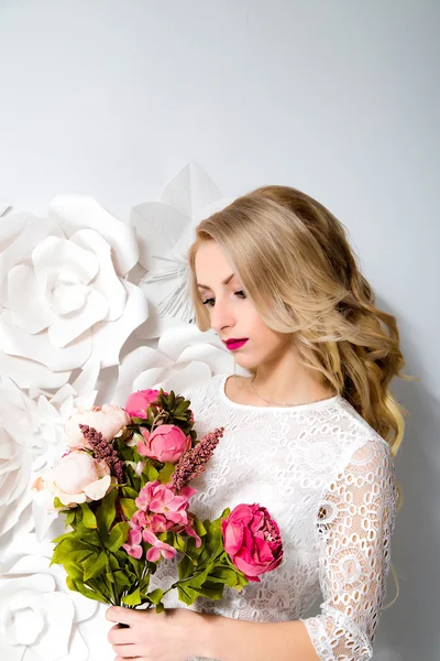 Young gorgeous woman, bride, blond long curly hair, studio decor