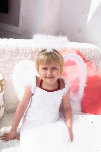 Portrait of beautiful princess girl in white dress with white ni