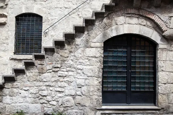 Window in a stone wall with stairs